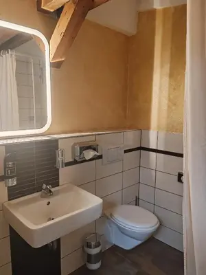 Ein Badezimmer in der Unterkunft Perle Hotel