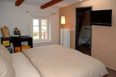 Ein Bett oder Betten in einem Zimmer der Unterkunft Perle Hotel