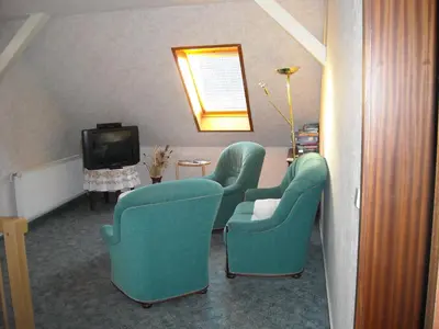 Ein Sitzbereich in der Unterkunft Ferienzimmer in Pension zur alten Weide im Oderbruch