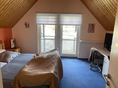 Ein Bett oder Betten in einem Zimmer der Unterkunft Ferienhaus Leuchtturmblick Hafendorf Rheinsberg