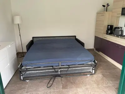Ein Bett oder Betten in einem Zimmer der Unterkunft 2 Bungalows in Motzen bei Berlin nur 300 m vom See und Strandbad entfernt