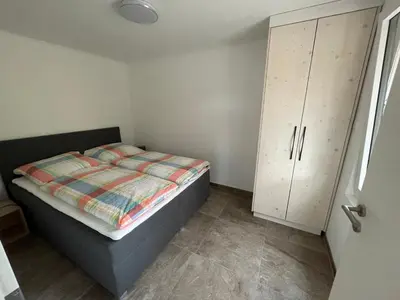 Ein Bett oder Betten in einem Zimmer der Unterkunft 2 Bungalows in Motzen bei Berlin nur 300 m vom See und Strandbad entfernt