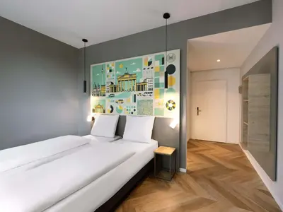 Ein Bett oder Betten in einem Zimmer der Unterkunft B&B HOTEL Berlin Airport-Nord