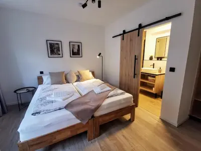 Ein Bett oder Betten in einem Zimmer der Unterkunft Pension Zum Stellmacher