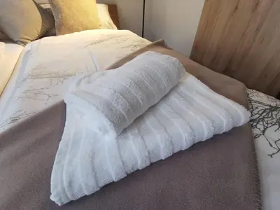 Ein Bett oder Betten in einem Zimmer der Unterkunft Pension Zum Stellmacher