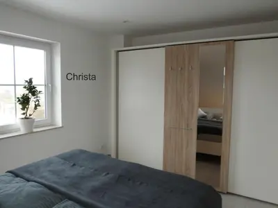 Ein Bett oder Betten in einem Zimmer der Unterkunft Ferienwohnung Christa & Rosmarie