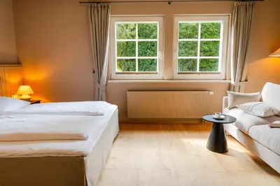 Ein Bett oder Betten in einem Zimmer der Unterkunft Seehotel Köllnitz