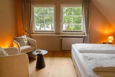 Ein Bett oder Betten in einem Zimmer der Unterkunft Seehotel Köllnitz