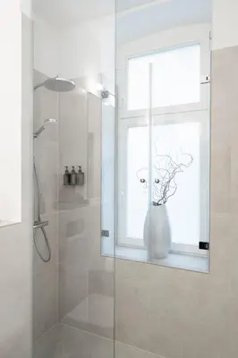 Ein Badezimmer in der Unterkunft Design Apartment with Garden