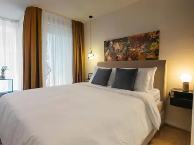 Ein Bett oder Betten in einem Zimmer der Unterkunft ALEXA Chic Design Apart up to 5 persons - Paid Parking - Superfast Wifi
