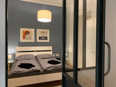 Ein Bett oder Betten in einem Zimmer der Unterkunft Schoene Ferien im Prenzlberg Ela