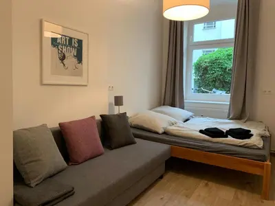 Ein Bett oder Betten in einem Zimmer der Unterkunft Schoene Ferien im Prenzlberg Ela