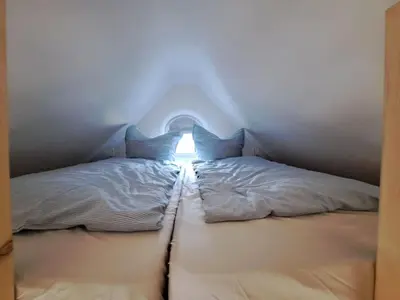 Ein Bett oder Betten in einem Zimmer der Unterkunft Tiny House im grünen Rangsdorf fuer 4 mit Kamin RAN