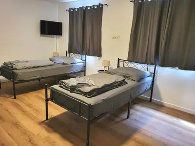 Ein Bett oder Betten in einem Zimmer der Unterkunft Monteur-Haus Veilchen Berlin Pankow, Französisch-Buchholz