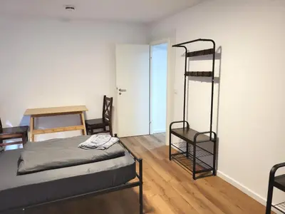 Ein Bett oder Betten in einem Zimmer der Unterkunft Monteur-Haus Veilchen Berlin Pankow, Französisch-Buchholz