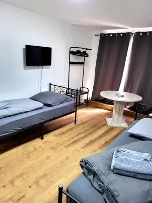Ein Bett oder Betten in einem Zimmer der Unterkunft Monteur-Haus Veilchen Berlin Pankow, Französisch-Buchholz