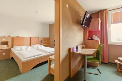 Ein Bett oder Betten in einem Zimmer der Unterkunft SONN IDYLL Aparthotel