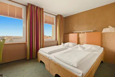 Ein Bett oder Betten in einem Zimmer der Unterkunft SONN IDYLL Aparthotel