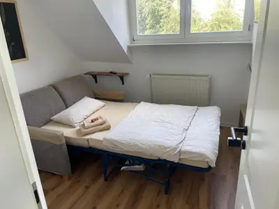 Ein Bett oder Betten in einem Zimmer der Unterkunft Rabbit House