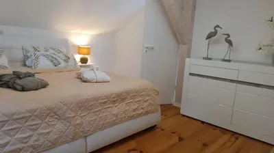 Ein Bett oder Betten in einem Zimmer der Unterkunft Luxus Summer Breeze Ferienhaus Lübbesee Sauna Bootssteg Templin