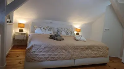 Ein Bett oder Betten in einem Zimmer der Unterkunft Luxus Summer Breeze Ferienhaus Lübbesee Sauna Bootssteg Templin
