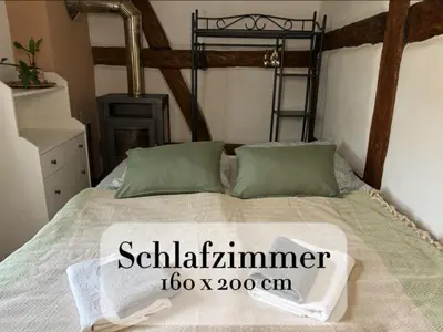 Ein Bett oder Betten in einem Zimmer der Unterkunft Altstadt & See & Garten Haustiere willkommen