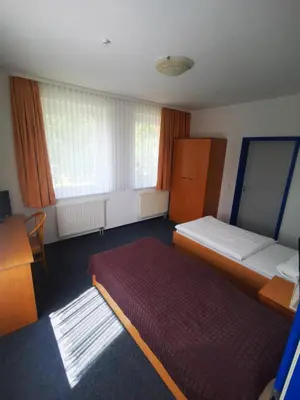 Ein Bett oder Betten in einem Zimmer der Unterkunft Pilotenunterkunft Fliegerhorst