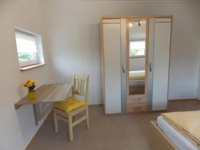 Ein Bett oder Betten in einem Zimmer der Unterkunft Ferienwohnung Sonnenblume