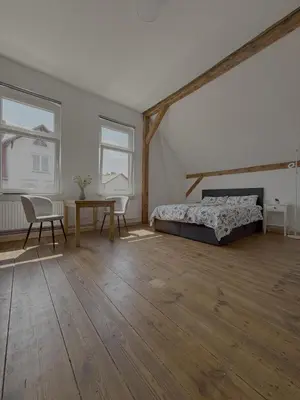Ein Bett oder Betten in einem Zimmer der Unterkunft Villa Zeppelin 1