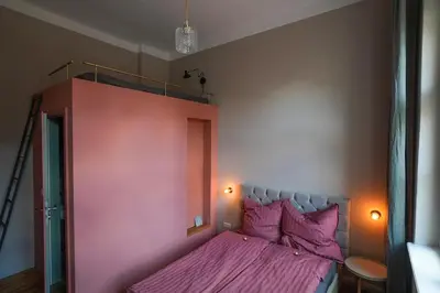 Ein Bett oder Betten in einem Zimmer der Unterkunft Bürgermeisterhaus Jüterbog - Gästeapartments am Kulturquartier