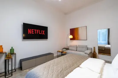 Ein Bett oder Betten in einem Zimmer der Unterkunft Nofa Apartments - Altbau Apartments am Kudamm