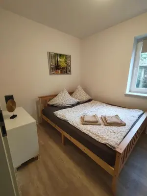 Ein Bett oder Betten in einem Zimmer der Unterkunft Ferienapartment am Dorfteich