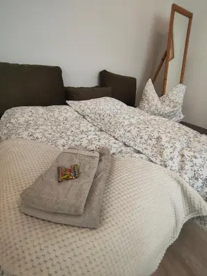 Ein Bett oder Betten in einem Zimmer der Unterkunft Ferienapartment am Dorfteich