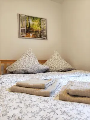 Ein Bett oder Betten in einem Zimmer der Unterkunft Ferienapartment am Dorfteich