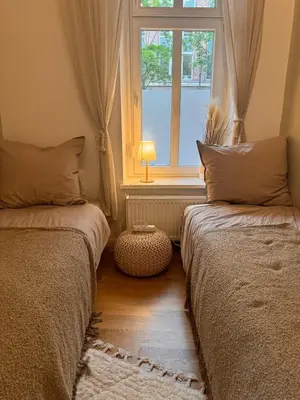 Ein Bett oder Betten in einem Zimmer der Unterkunft Cozy Altbau in Friedrichshain - Westwing Design
