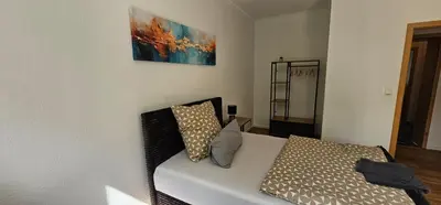 Ein Bett oder Betten in einem Zimmer der Unterkunft Stadtquartier No 1