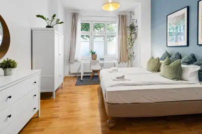 Ein Bett oder Betten in einem Zimmer der Unterkunft Home in Friedrichshain