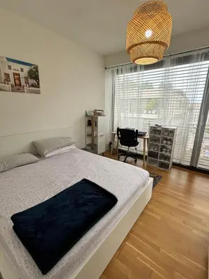 Ein Bett oder Betten in einem Zimmer der Unterkunft Check Point Charlie Luxury Apartment with Balcony