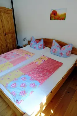 Ein Bett oder Betten in einem Zimmer der Unterkunft Sonnenlandhof