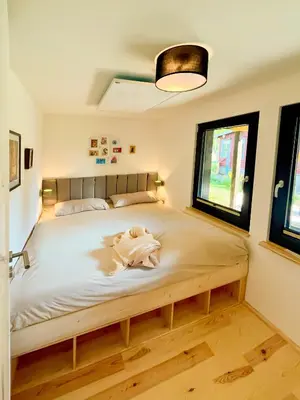 Ein Bett oder Betten in einem Zimmer der Unterkunft Haus 2 am Grimnitzsee - hochwertiges Design, mit eigenem Garten und nah am See