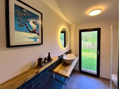 Ein Badezimmer in der Unterkunft Haus 2 am Grimnitzsee - hochwertiges Design, mit eigenem Garten und nah am See