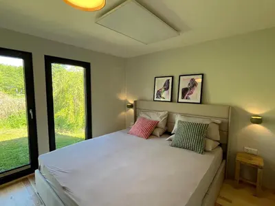 Ein Bett oder Betten in einem Zimmer der Unterkunft Haus 2 am Grimnitzsee - hochwertiges Design, mit eigenem Garten und nah am See