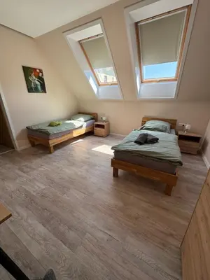 Ein Bett oder Betten in einem Zimmer der Unterkunft Herberge in der Orangerie auf dem Schlossgut Altlandsberg