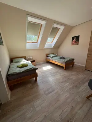 Ein Bett oder Betten in einem Zimmer der Unterkunft Herberge in der Orangerie auf dem Schlossgut Altlandsberg