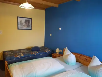 Ein Bett oder Betten in einem Zimmer der Unterkunft Pension zum Wiesengrund