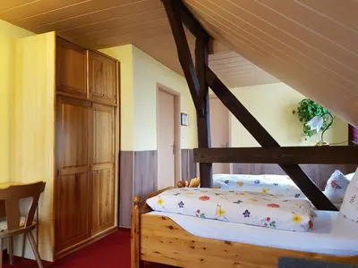 Ein Bett oder Betten in einem Zimmer der Unterkunft Pension zum Wiesengrund