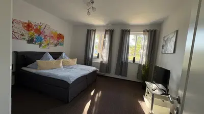 Ein Bett oder Betten in einem Zimmer der Unterkunft Haus am Röblinsee - Ferienwohnungen in Fürstenberg