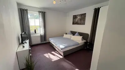 Ein Bett oder Betten in einem Zimmer der Unterkunft Haus am Röblinsee - Ferienwohnungen in Fürstenberg