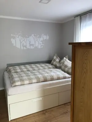 Ein Bett oder Betten in einem Zimmer der Unterkunft Ferienhaus Kiefernwäldchen Mellensee