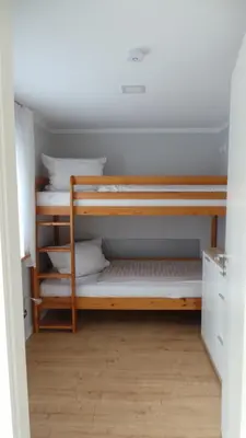 Ein Bett oder Betten in einem Zimmer der Unterkunft Ferienhaus Kiefernwäldchen Mellensee